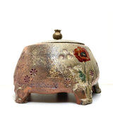 Lidded poppy canister