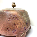 Lidded poppy canister